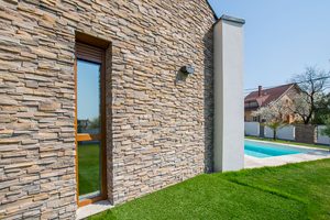 Grenada Volcanic stone cladding on modern house exterior