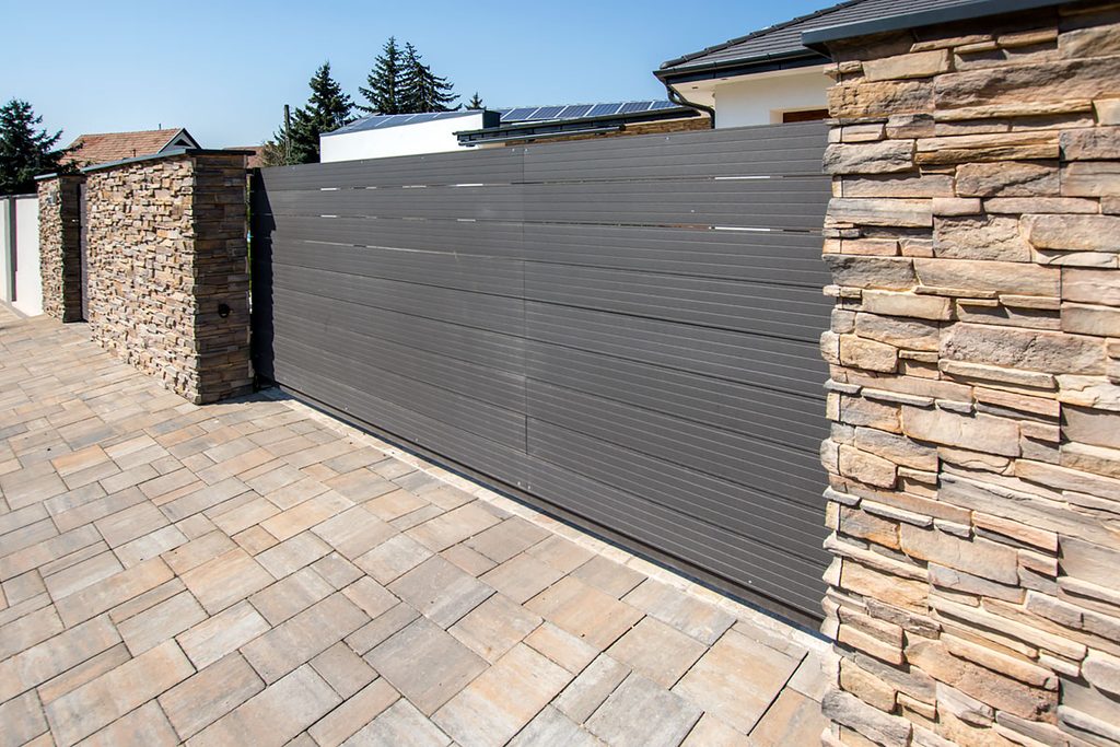 Grenada stone cladding installed on exterior boundary walls