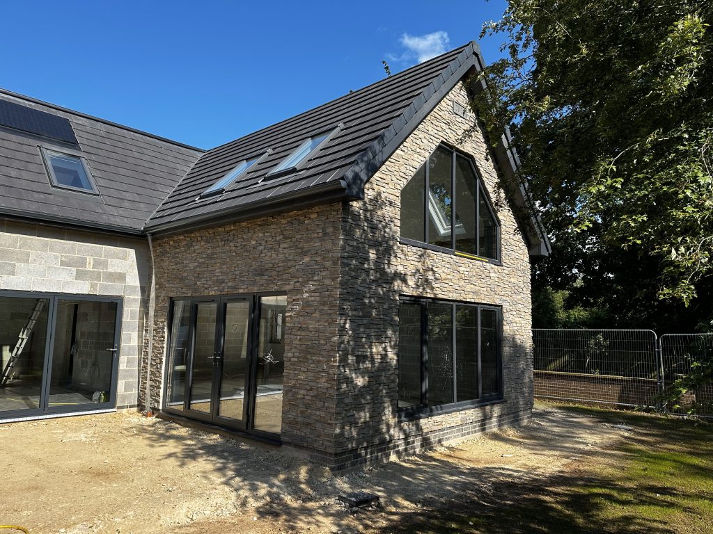 Stone cladding and brick finishes on residential property exterior