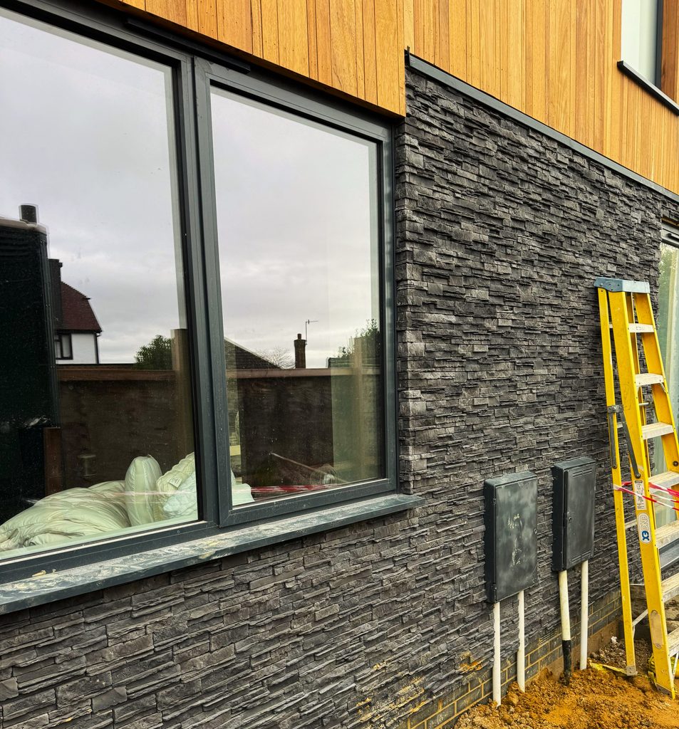 Finished Cumbrian Slate exterior with cedar cladding above