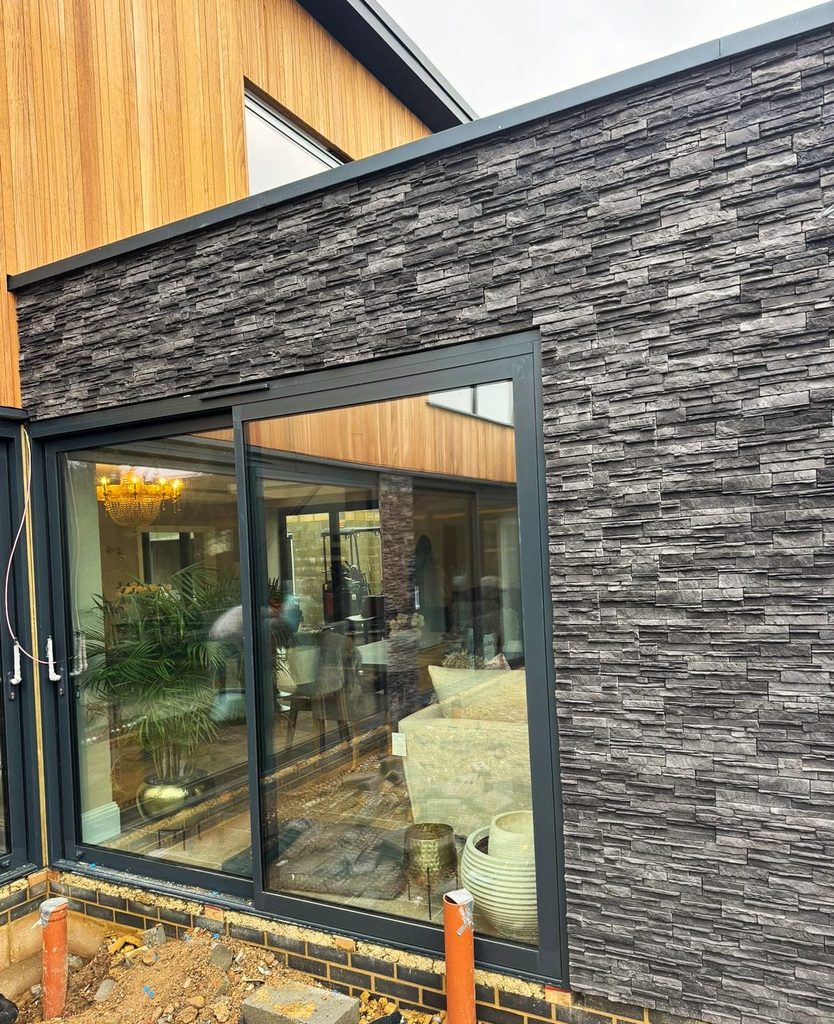 Dark graphite stone cladding on finished ground floor exterior