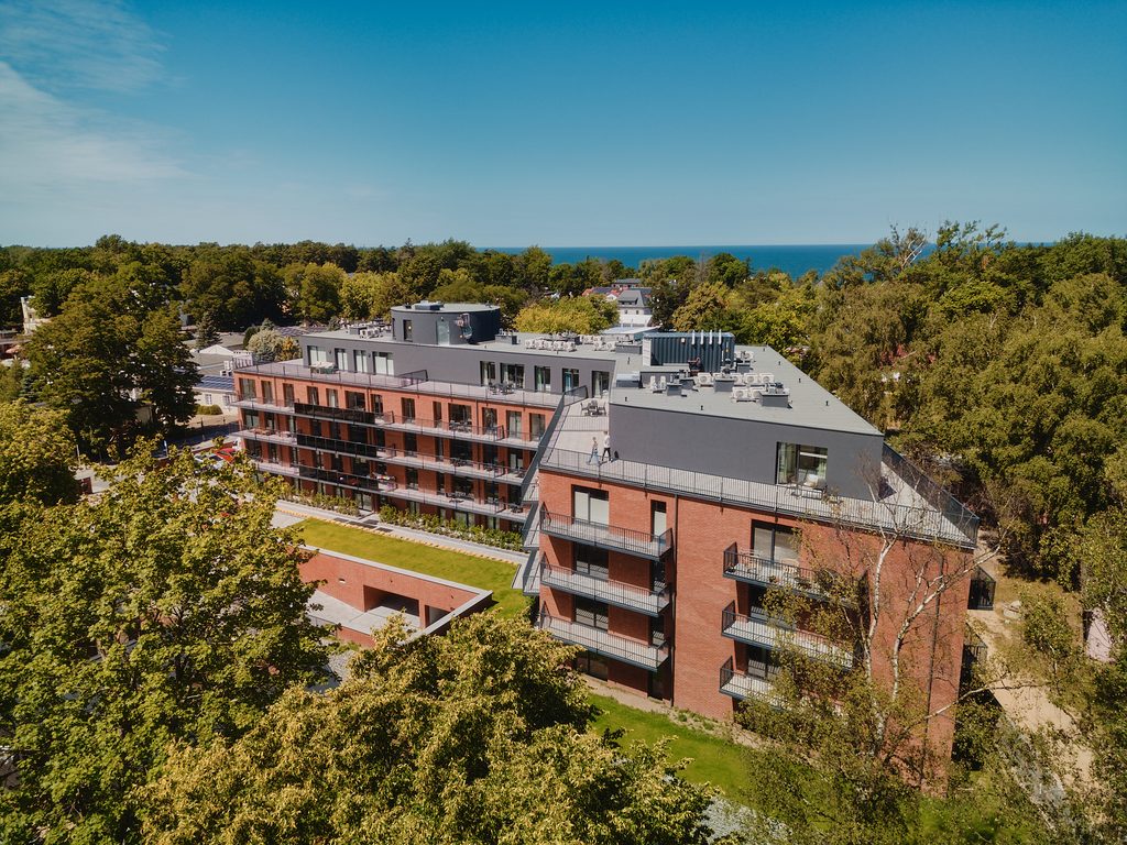 Cambridge 8 Red brick slip installation on a seven-storey seaside hotel in Poland