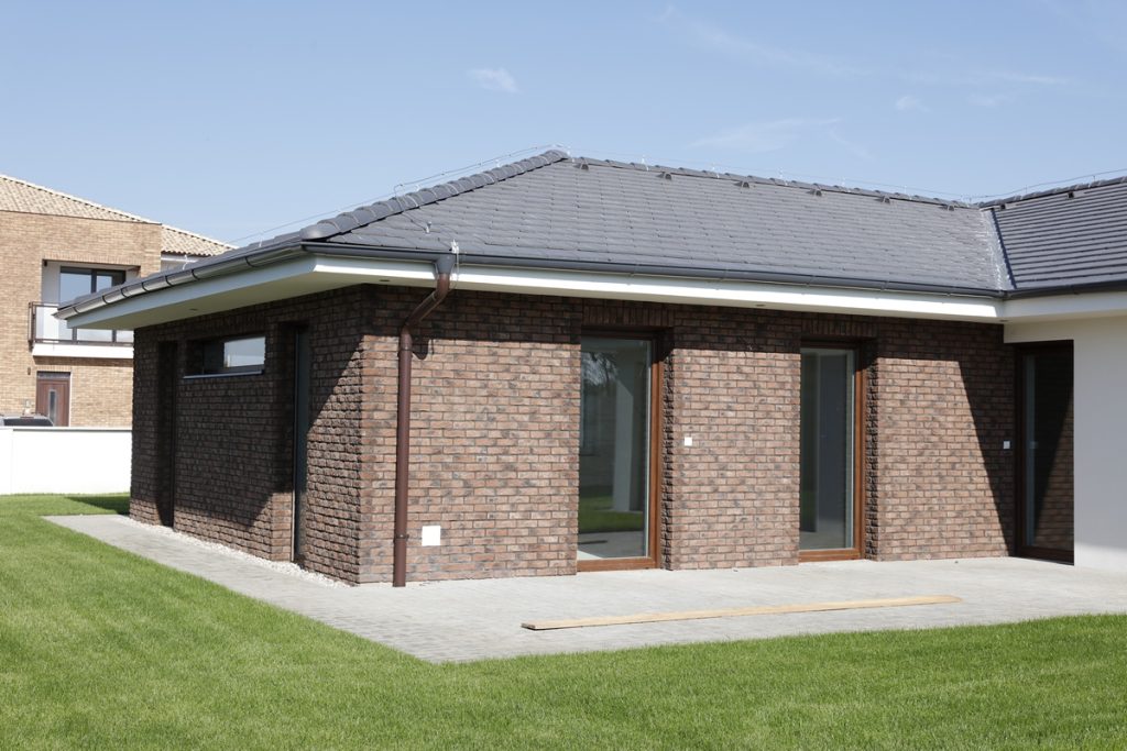 New-build bungalow exterior finished with Rustic Red brick slips