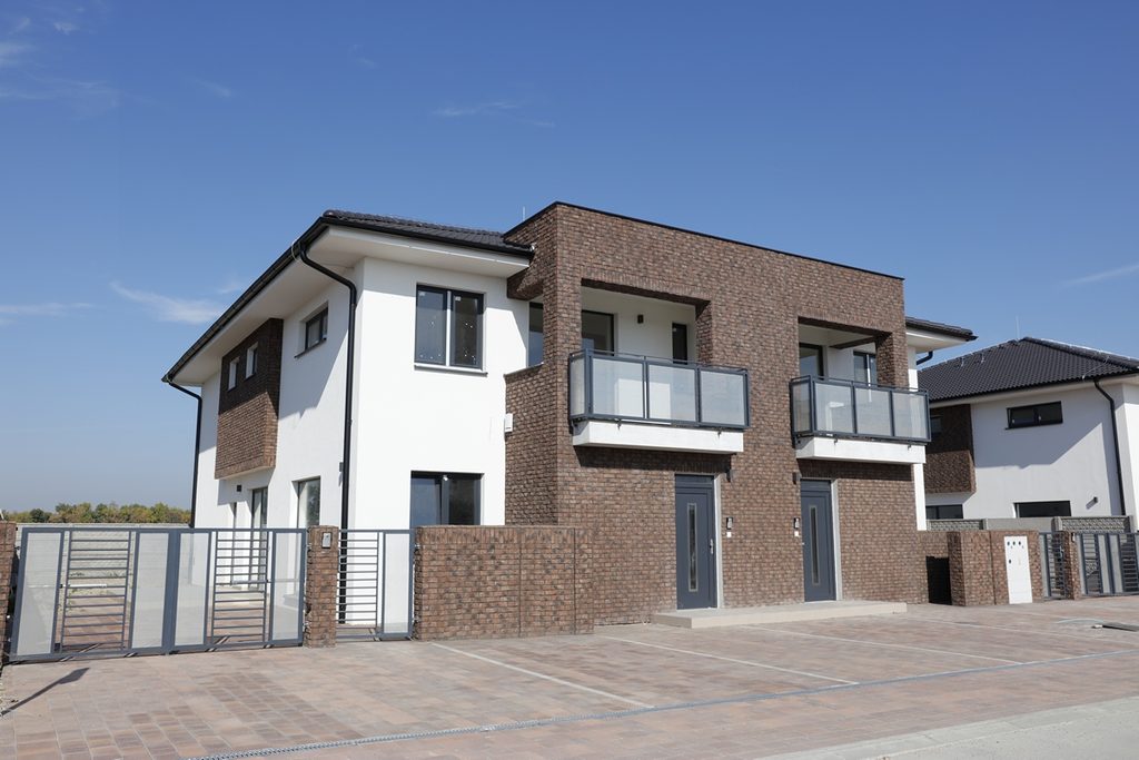 Rustic Red brick slip installation on semi-detached homes