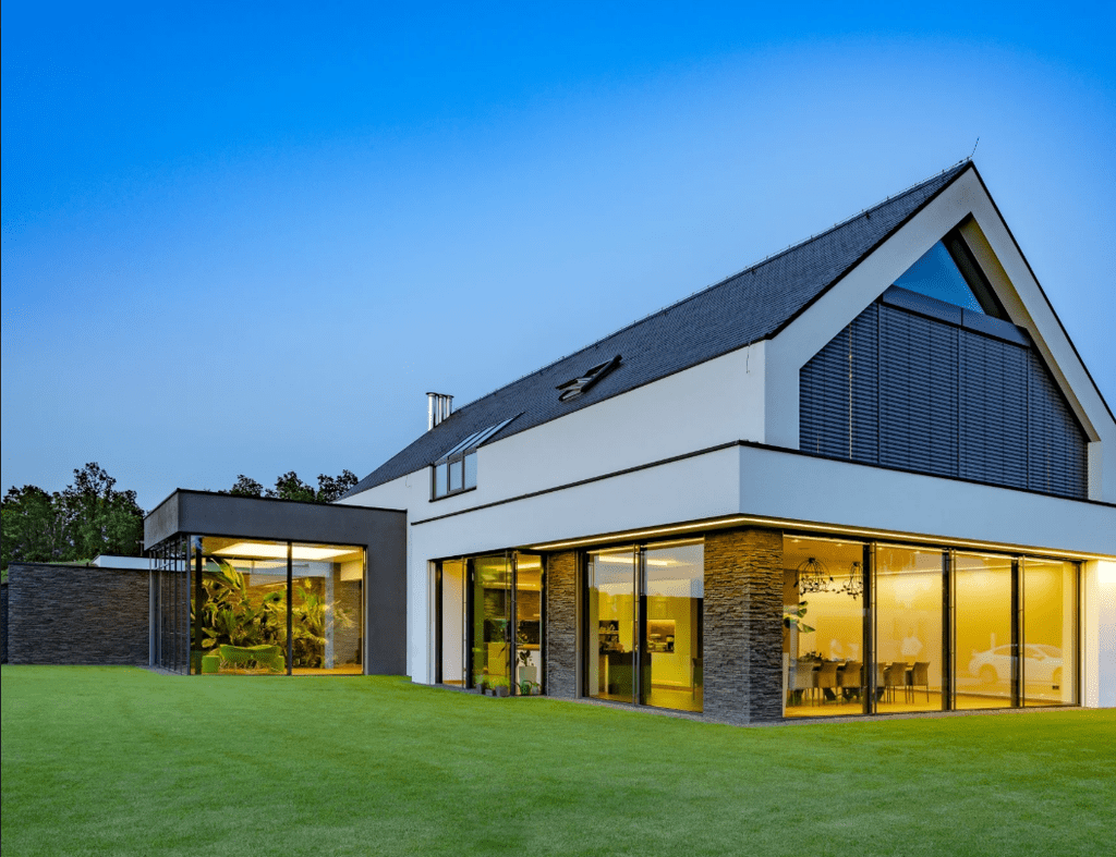 Sierra Graphite stone cladding with bright cream render on Cheshire property